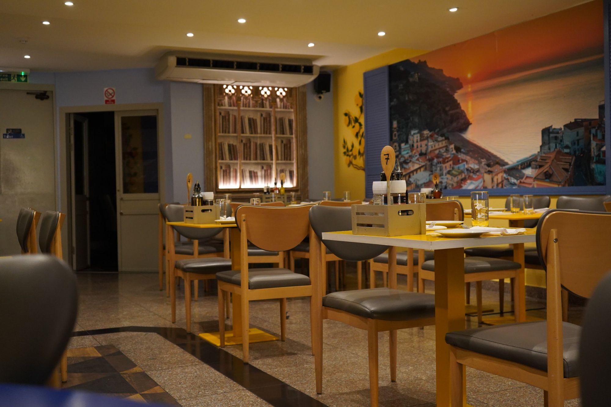 The main dining room at Minori, under the Amalfi coast mural