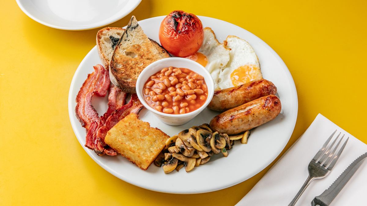 A full English breakfast with eggs, sausages, bacon and beans